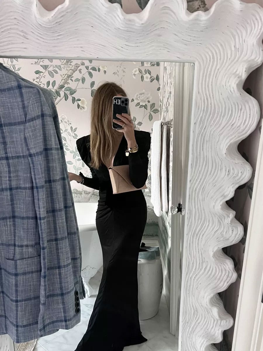 Black wedding guest dress and chic envelope clutch